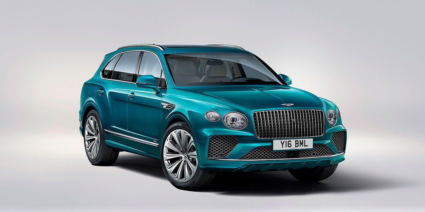 Bentley Ho Chi Minh Bentley Bentayga Azure front three-quarter view, featuring a fluted chrome grille with a matrix lower grille and chrome accents in Topaz blue paint.