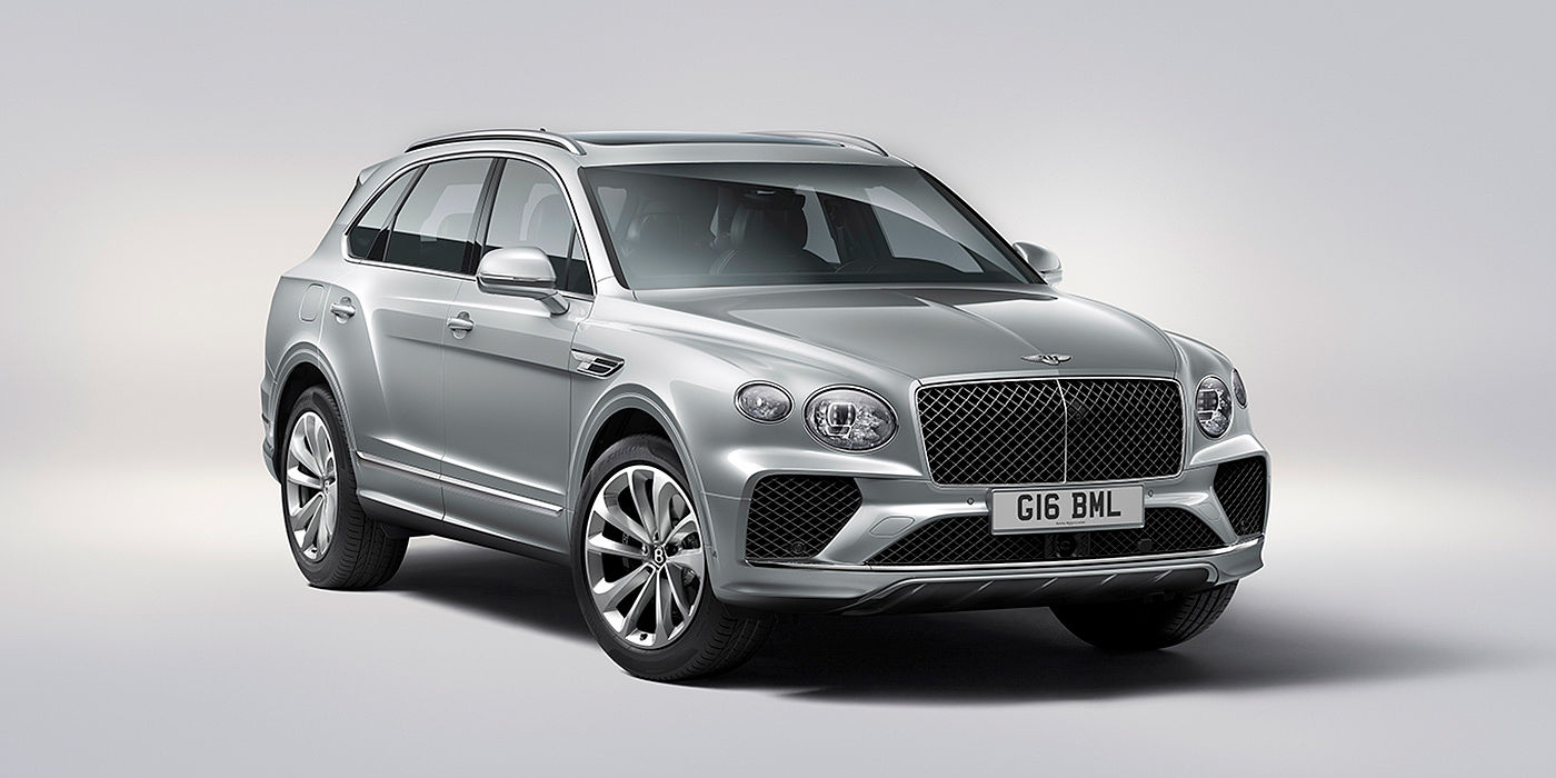 Bentley Ho Chi Minh Bentley Bentayga in Moonbeam paint, front three-quarter view, featuring a matrix grille and elliptical LED headlights.