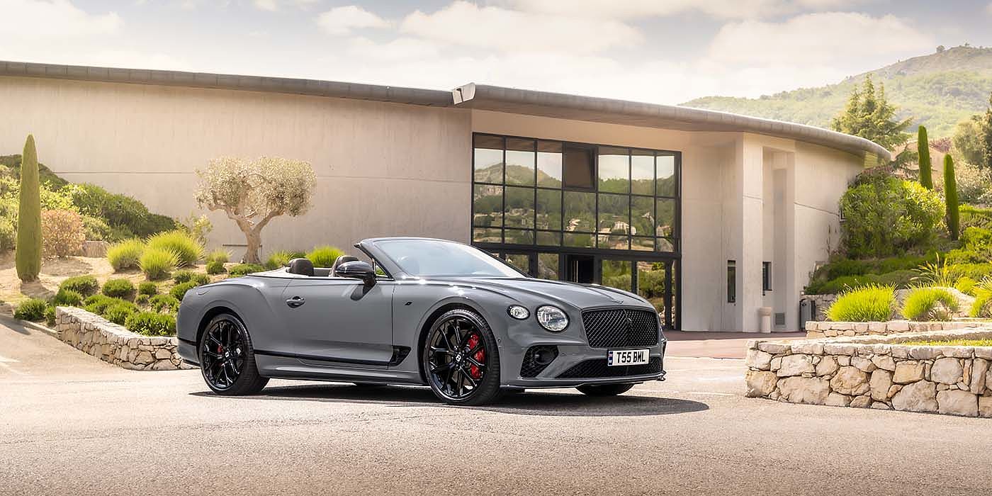 Bentley Ho Chi Minh Bentley Continental GTC S convertible in Cambrian Grey paint front 34 static near house