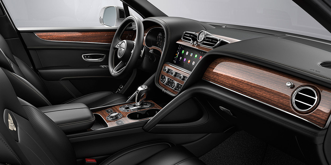 Bentley Ho Chi Minh Bentley Bentayga interior with a Crown Cut Walnut veneer, view from the passenger seat over looking the driver's seat.