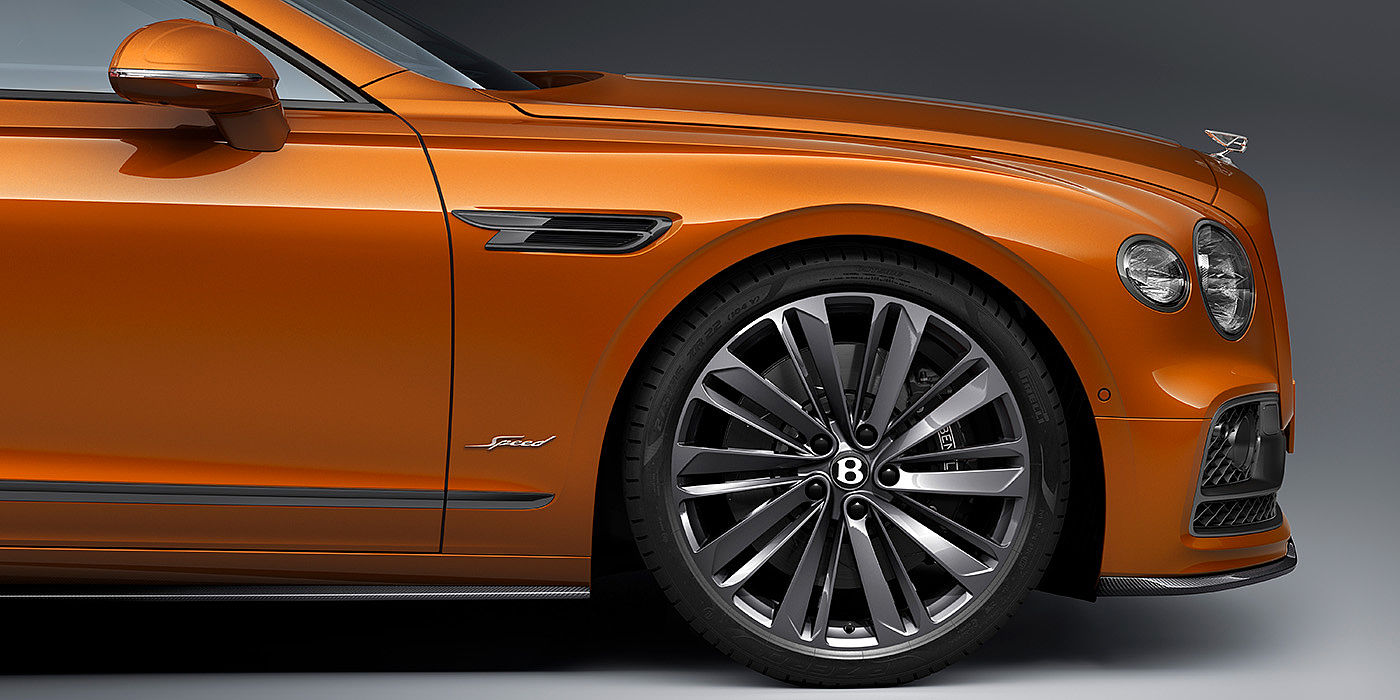 Bentley Ho Chi Minh Bentley Flying Spur Speed 22 inch dark tint front wheel against Orange Flame by Mulliner paint