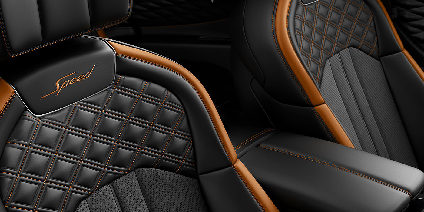 Bentley Ho Chi Minh Bentley Flying Spur Speed seat close up of diamond in diamond stitching in Mandarin by Mulliner and Beluga Black hide
