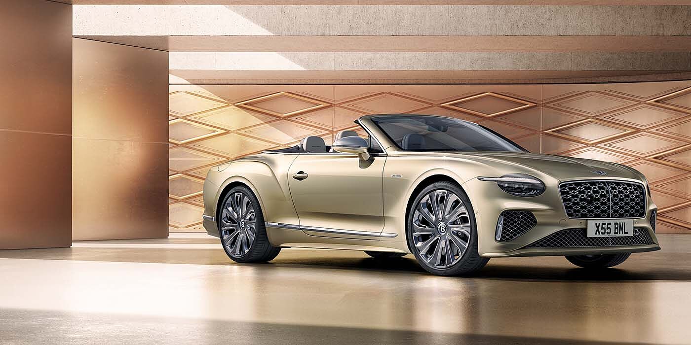 Bentley Ho Chi Minh Bentley New Continental GTC Mulliner V8 hybrid front three quarters in Patina paint