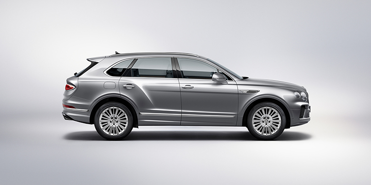 Bentley Ho Chi Minh Bentley Bentayga SUV side profile in Moonbeam silver paint against white background featuring 21 inch 5 spoke wheels