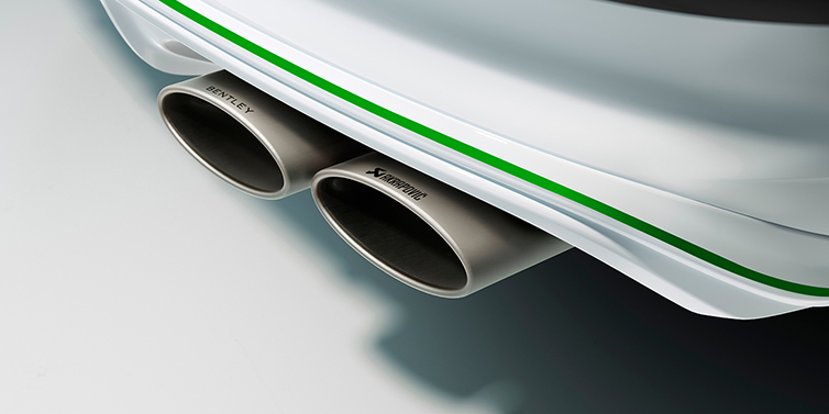 Bentley Bentayga Speed SUV features prominent elliptical exhaust tips at the rear, integrated within the diffuser.