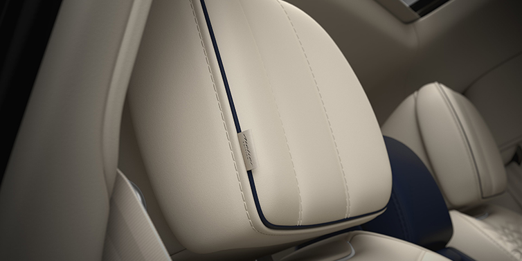 Bentley Bentayga EWB Atelier Edition headrest with Atelier Edition embroidered logo in luxurious detail, showcasing craftsmanship and exclusivity